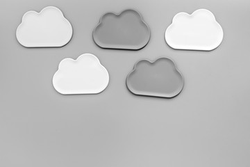 Clouds figures for cloud storage on gray background top view mockup