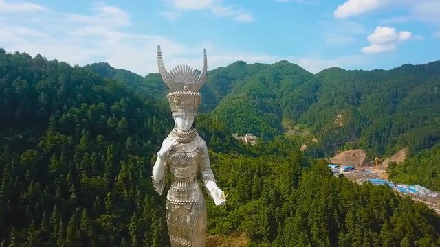 The statue “Yang Asha,” located beside Yang Asha Lake, Jianhe County, Guizhou Province. (aerial photography)
