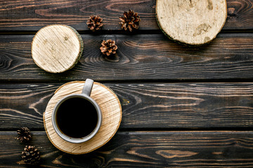 Tree stumps, coffee and cones for presentation background top view copy space