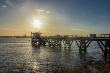 Naklejka na ściany i meble Pier at Holehaven, sunset.