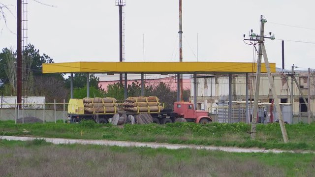 Big truck with gas bottles at the old gas station
