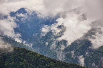 Mountain peaks in fog scenery landscape