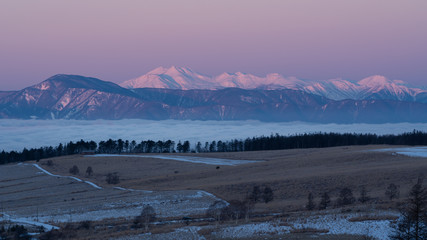 winter landscape with sea of clouds and mountains
