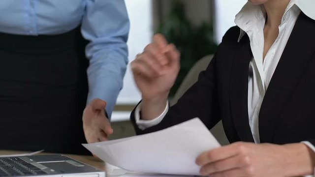 Confused secretary listening to shouting female boss, work conflict, mistake