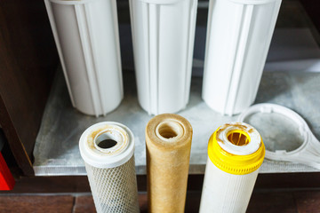 It's time to change water filters at home.  Replace filters in water purifying system. Close up...