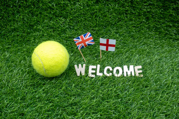Tennis welcome with Union Jack and England flag on green 