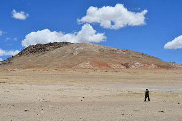 Tibet, China. Tourist on the shore of lake Gomang