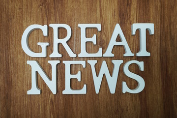 Fototapeta premium Great News word alphabet letters on wooden background