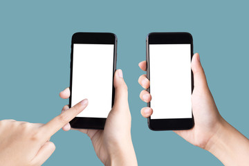 two hands holding and playing smart phones on pastel background with clipping path