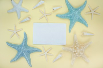 Summer Mockup.summer Sea Flat lay. marine decorative stars and shells, white frame for text on yellow  background.Summer To-do list.Summer sea vacation mockup. top view, copy space.