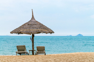 Sun loungers and beach umbrellas on the beach concept