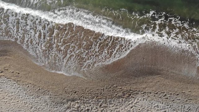 Beautiful HD beach aerial - a bird's eye view of waves