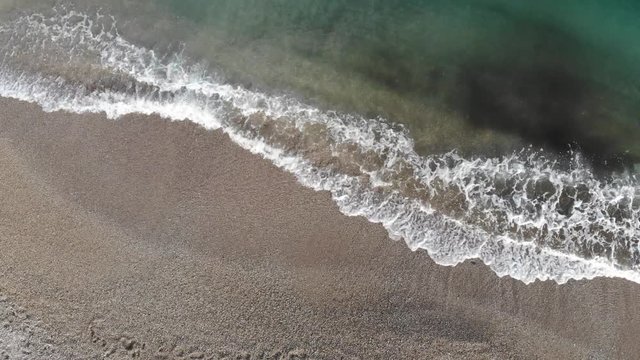 Static drone aerial view 4k shot - beautiful sea waves on the beach