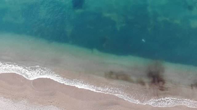 Beautiful sea waves on the beach - aerial view drone HD shot.