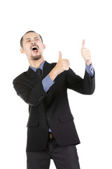 Asian excited man dressed in formal wear giving thumbs-up.