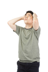 Young Asian boy over white background, be upset; have a bad temper emotional.
