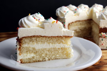 A piece of cake with white cream birthday in a small and small