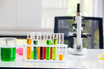 Assorted laboratory glassware equipment ready for an experiment in a science research lab. Laboratory glassware