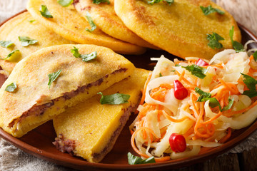 Salvadoran papusa served with curtido closeup. horizontal