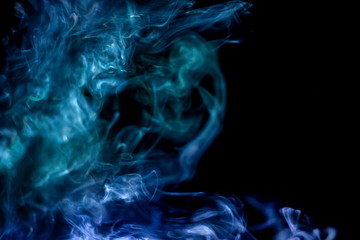 Fototapeta premium projector spotlight blue color , abstract smoke texture background . screening and glowing for movie cinema and film multimedia production in dark black room at night , copy space