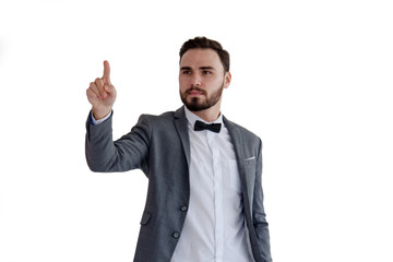 Man is standing and shows outstretched hand with open palm. Businessman hand touching virtual screen