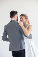 Wedding couple in love. Beautiful bride in white dress  and man handsome ,white  background