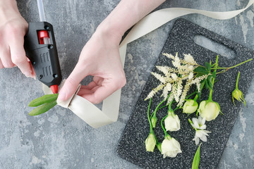 How to make wrist corsage for bride using rose and eustoma flowers.