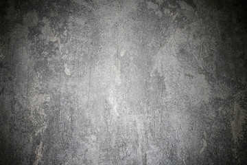 Dramatic lighting on grey stone background