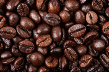 Strong roasted coffee beans texture background.