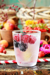 Homemade fruit lemonade with icecubes.