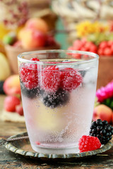 Homemade fruit lemonade with icecubes.