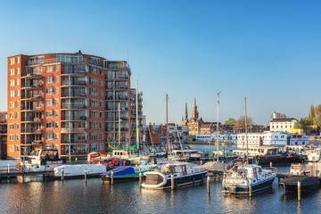 Fototapeta na wymiar Impression of Zaandam located along the river Zaan seen from the marina