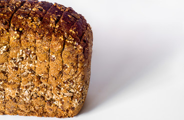 Homemade bread with flax and sesame sunflower seeds. Isolated on white background. Free space.