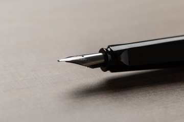 Black fountain pen on table