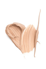 Smears of foundation for face isolated on white background