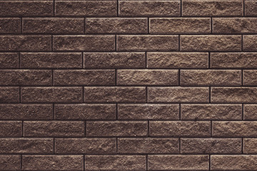 Abstract brown brick wall texture for wallpaper design. Brick wall grunge background. Wall cement texture. Dark stone background. Decorative tile on concrete wall.