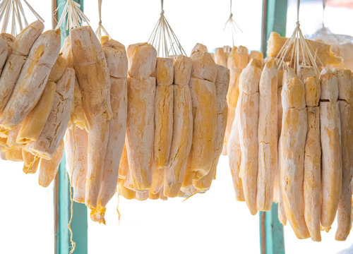 Heavenly Sweet Dried Alcoholic Fermented Cassava or Tapai Peuyeum Hanging At The Store Display After Fermentation Process with Yeast