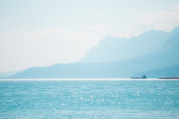 Snow-capped mountains and the sea.