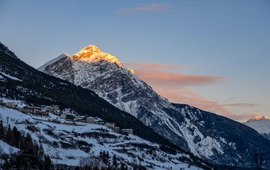 winter landscape (at sunset) of the high Valtellina, between the Italian central Alps, village of valdidentro, sondrio, italy