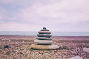 Pyramid of flat stones in the sunset light.