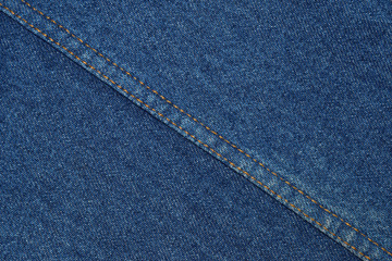 textured background of denim with vertical and diagonal seam