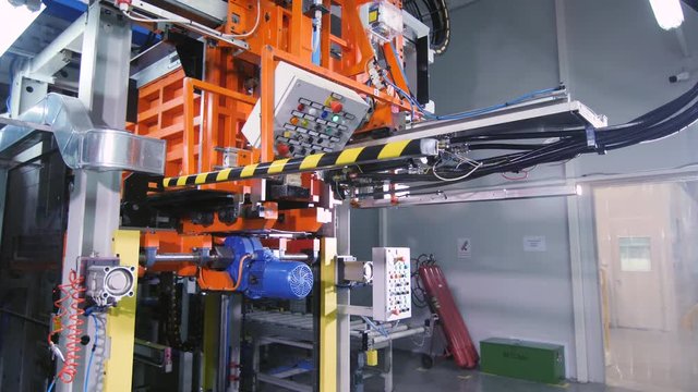 automated machine with control panels in plant workshop