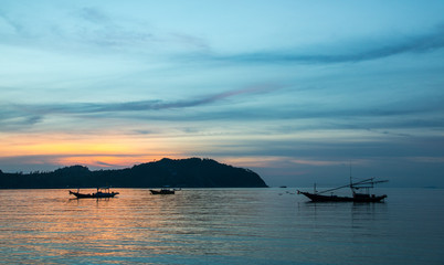 Fishermen boat at sunset near Koh Phangan island, Thailand