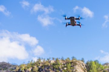Fototapeta na wymiar Drone flying over sky background