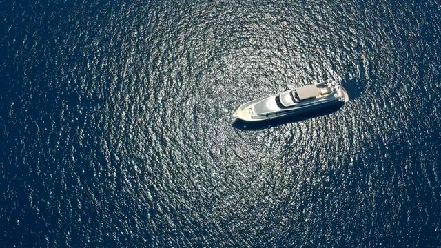  Aerial view to yacht in deep blue sea 
