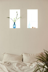 bed room with plant decorations at the daylight