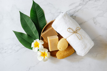 Top view of spa set with towels flower, Luffa, Mortar and stone. Relaxation concept
