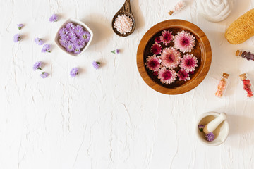 Top view of spa set with towels flower, Luffa, Mortar and stone. Relaxation concept