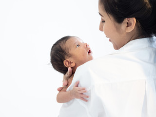 Portrait of Asian young mother  newborn son in living room
