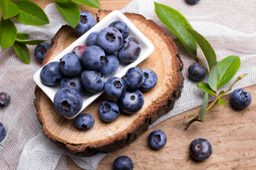 Fresh organic berries on a wooden background.